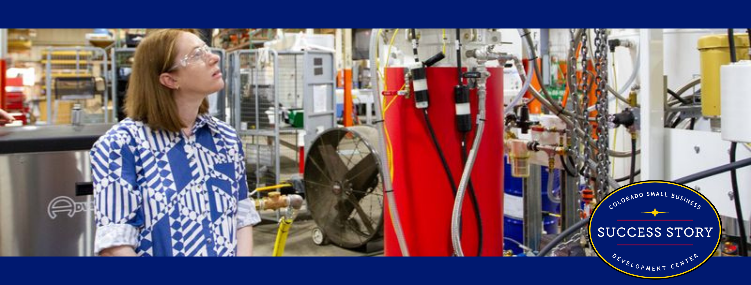 a person is looking at a machine in a factory.
