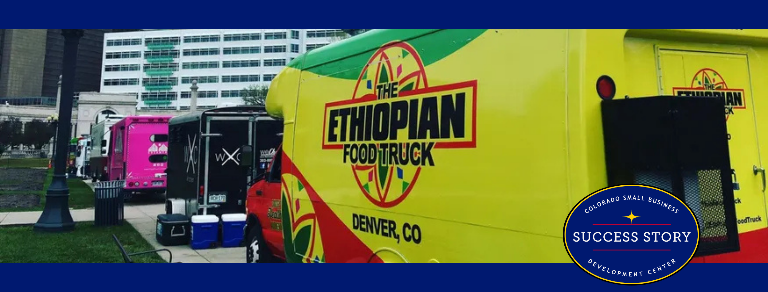 a colorful food truck parked in front of a building