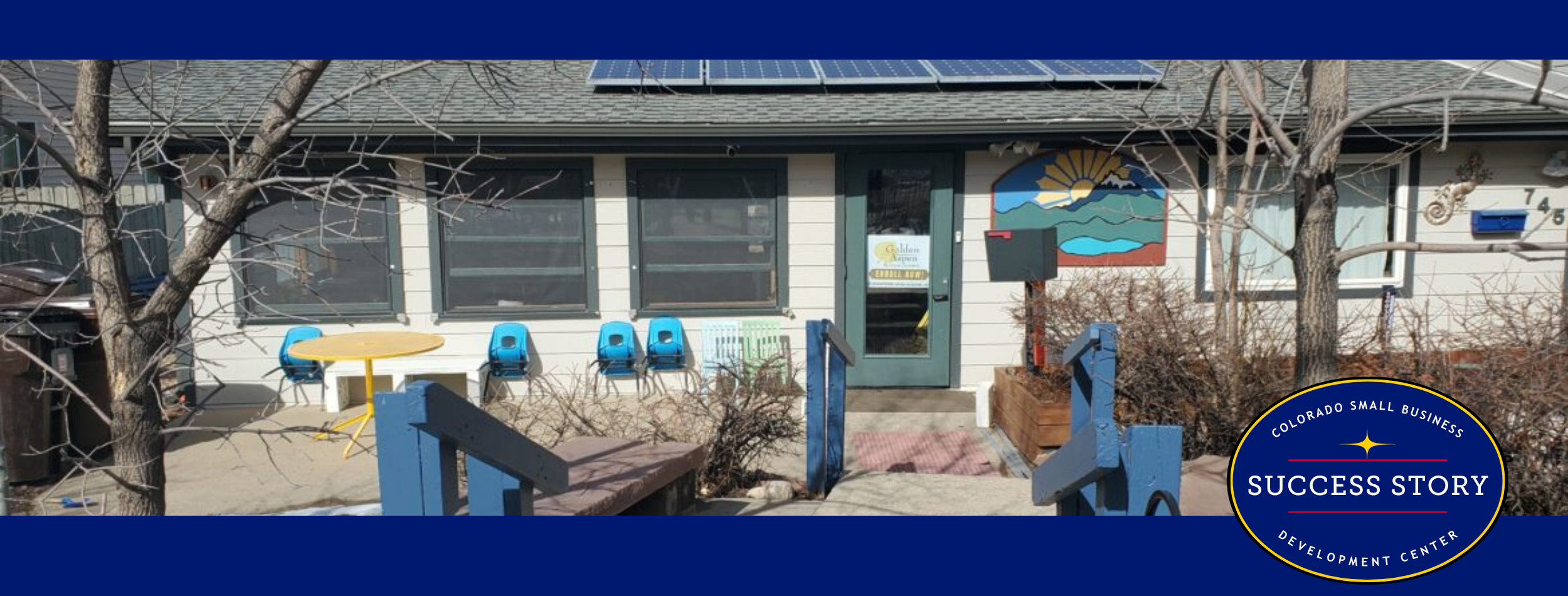 an exterior picture of a preschool building with solar panels on the roof.