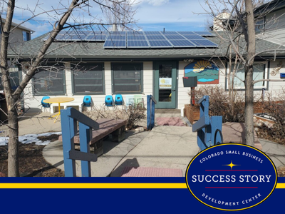 an exterior picture of a preschool building with solar panels on the roof.
