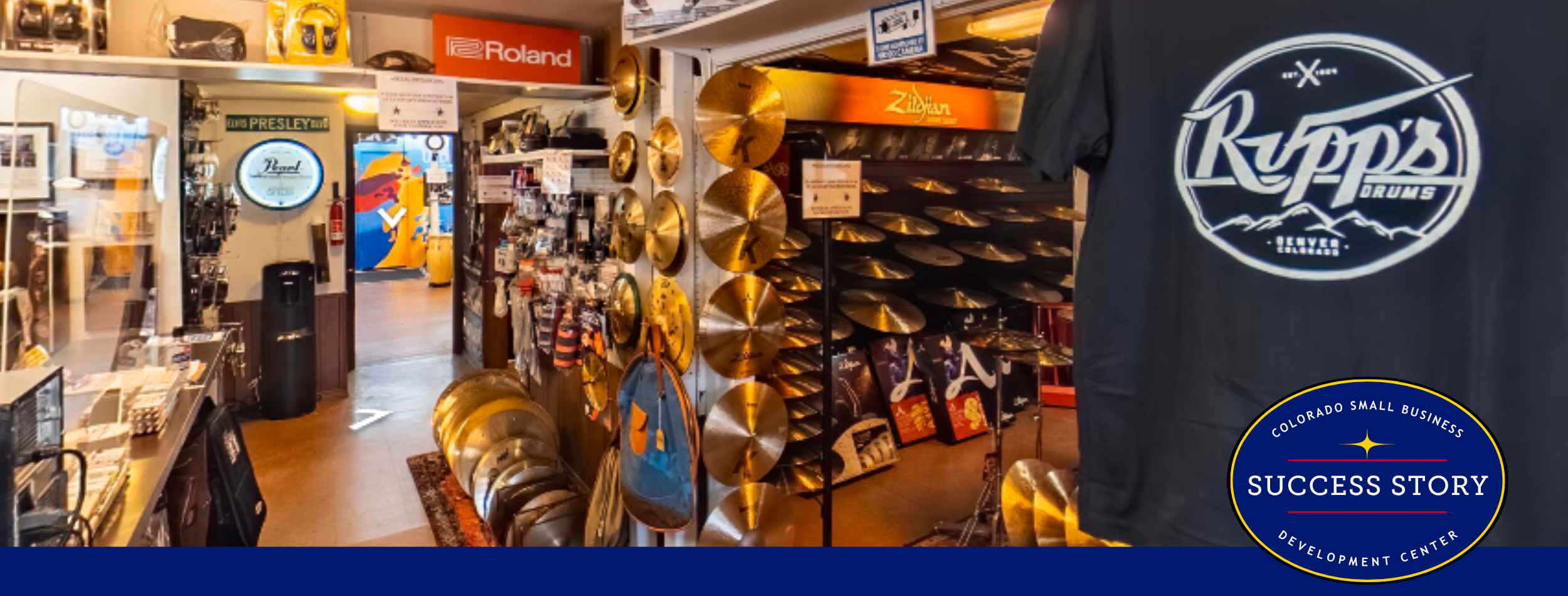 the inside of a store with many music items and instruments .on display.