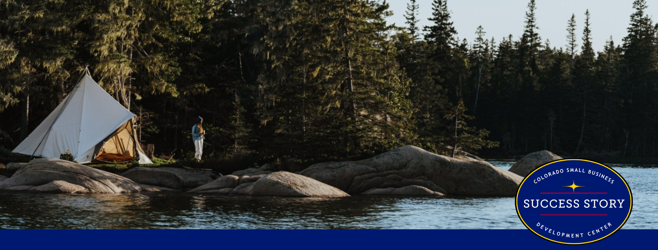 a tent on a rock in the middle of a lake.