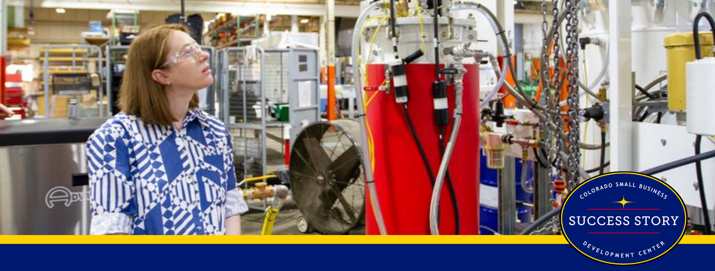 a person is looking at a machine in a factory.
