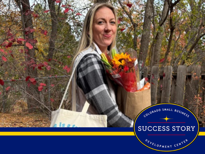 a person holding a bag of flowers and a tote bag.