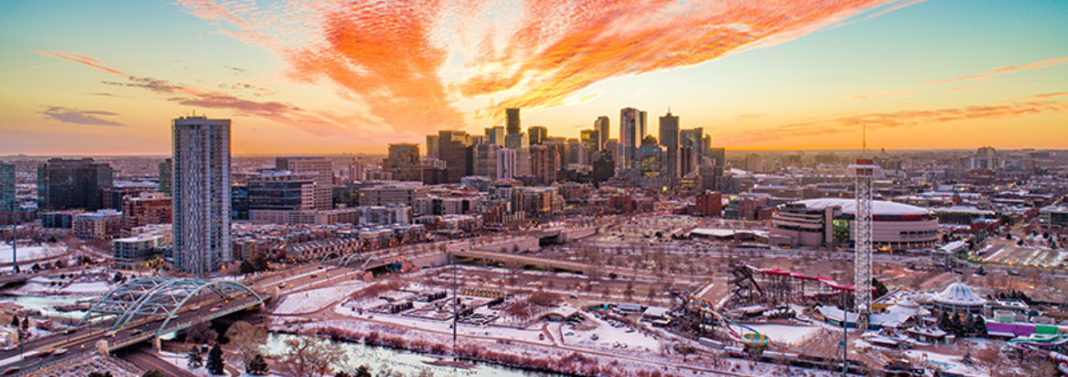 an aerial view of Denver at sunset.