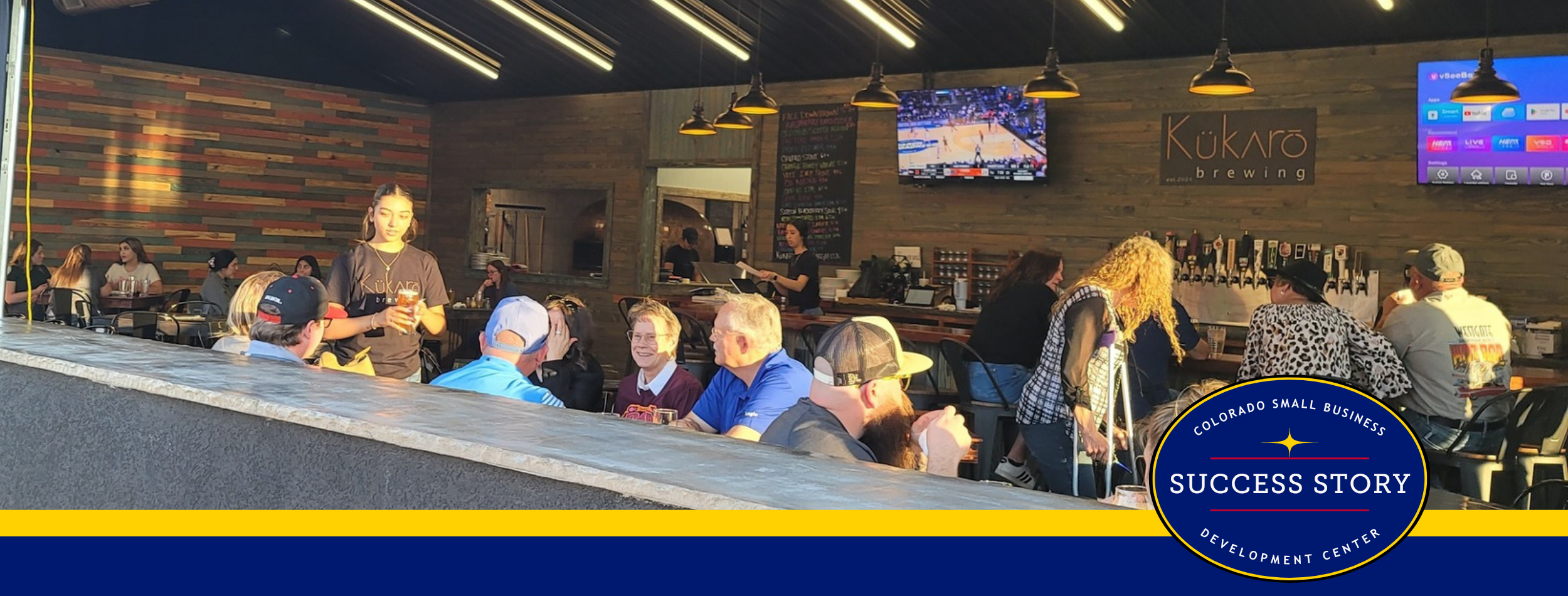 a group of people sitting at tables in front of a bar.