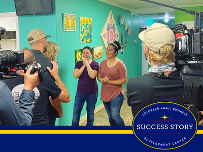 a group of people standing in front of a camera