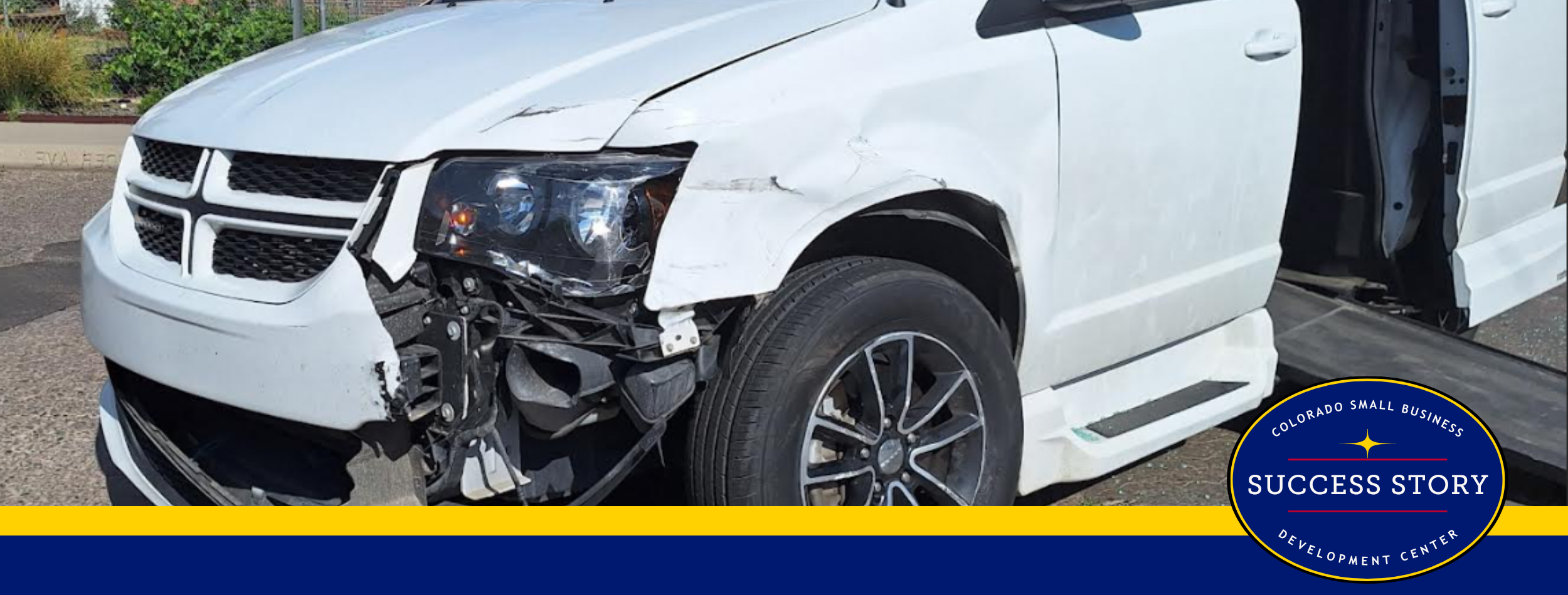 a damaged van is parked on the side of the road.