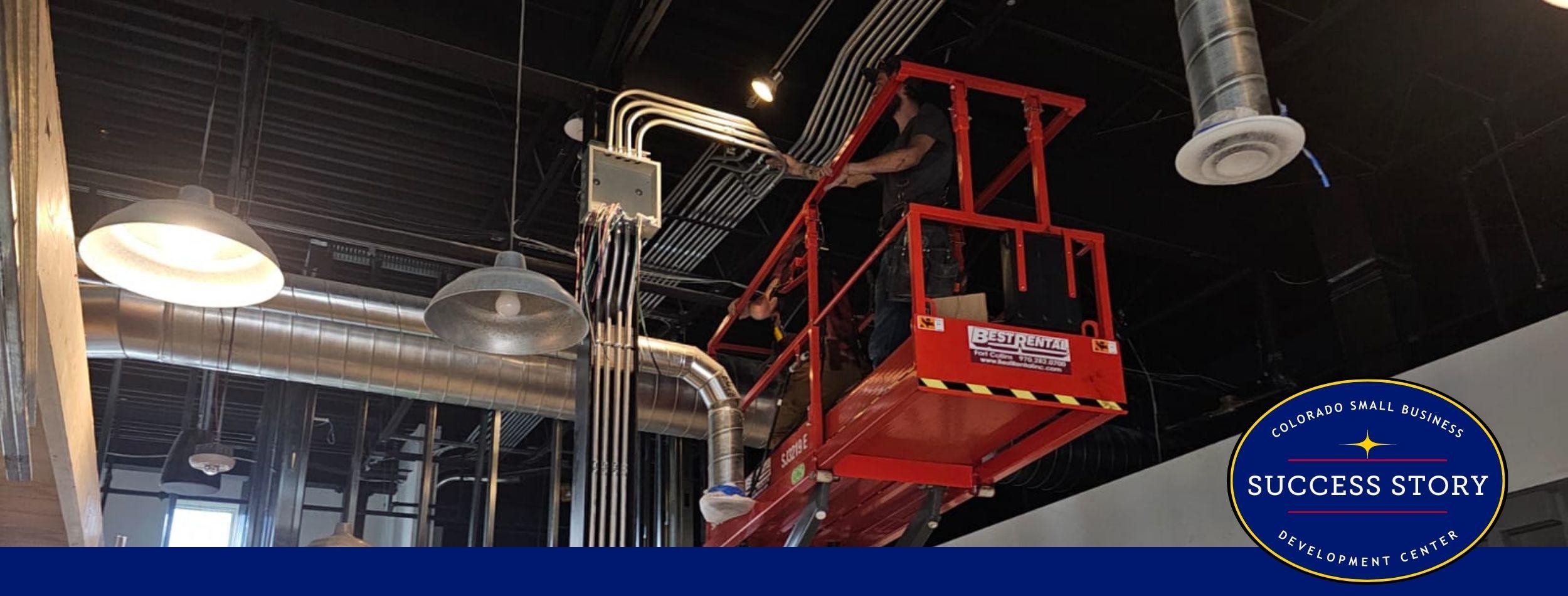 a person is working on a lift in a building.
