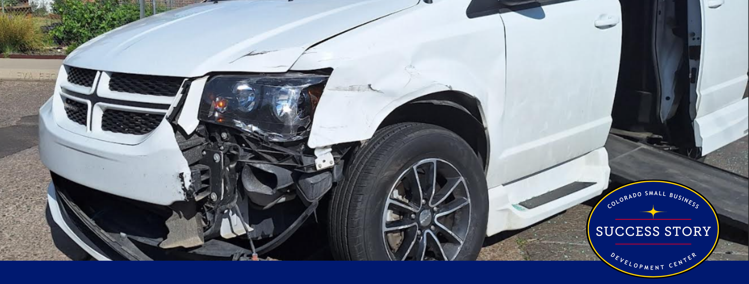 a damaged van is parked on the side of the road.