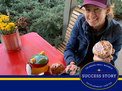 a person sitting at a table with a cup of coffee and donuts