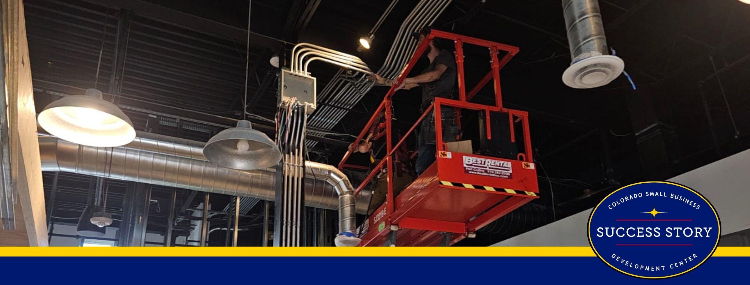 A person is working on a lift in a building.