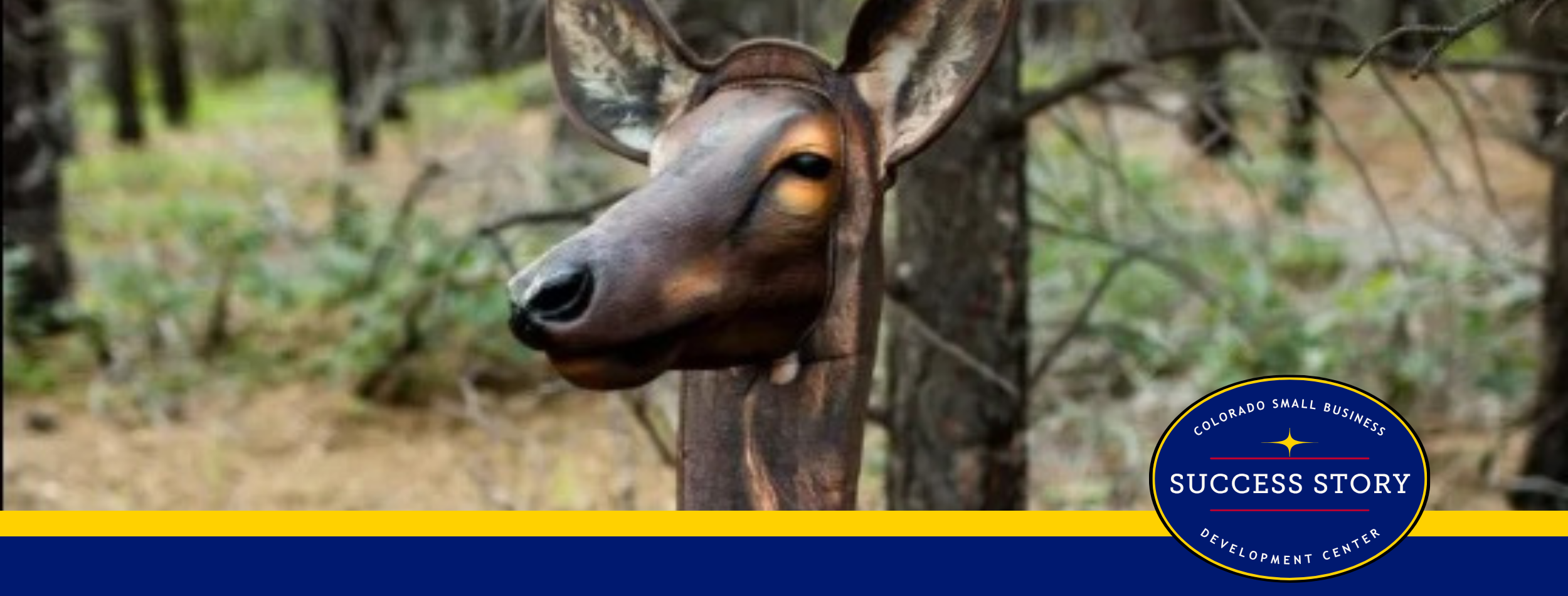a deer head mounted on a tree in the woods.