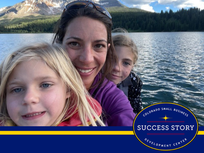 a family on a boat in front of a mountain.