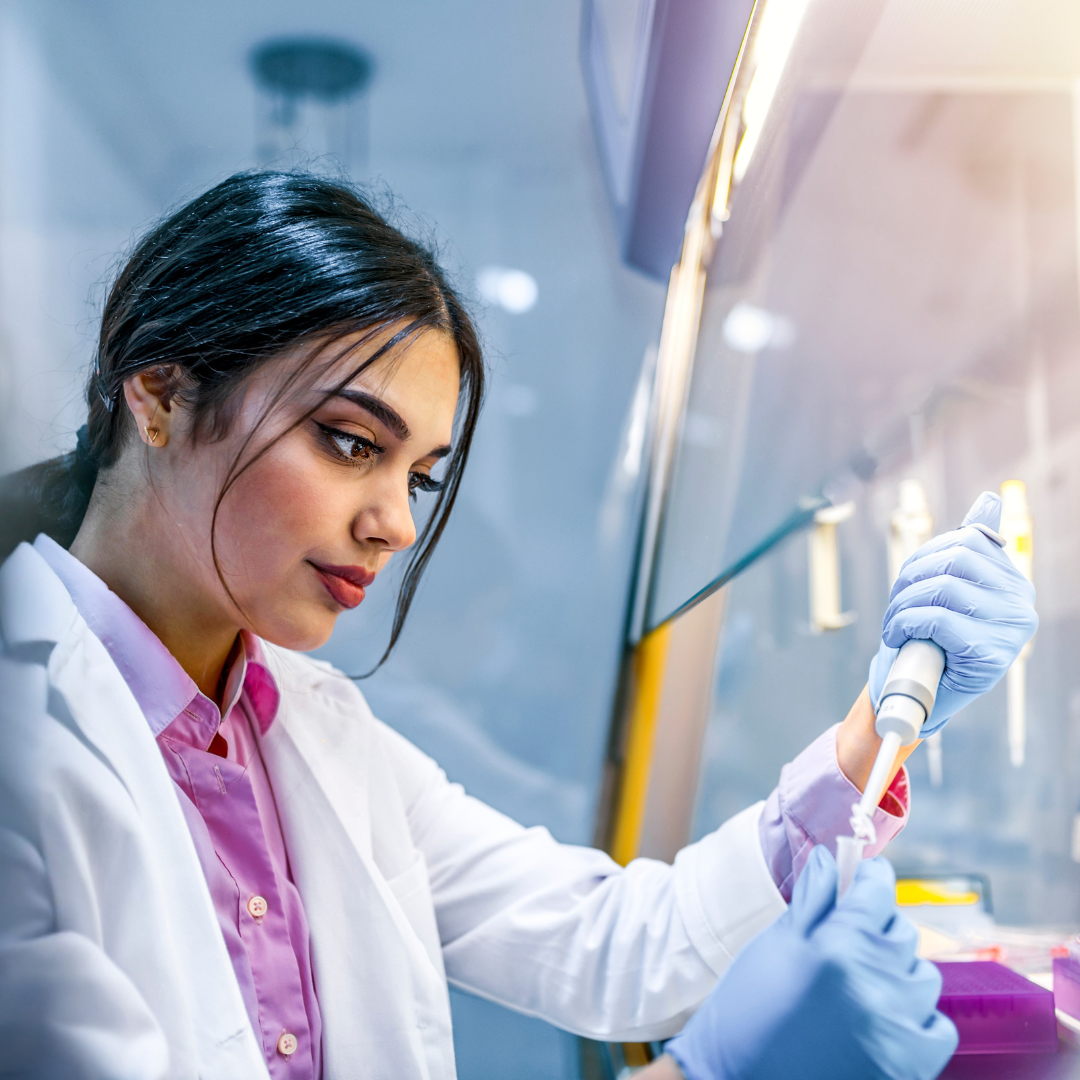 a person in a lab coat is working on something.