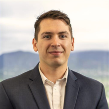 person in professional attire smiling 