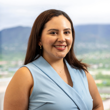 person in blue top smiling 