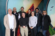 Portrait of a group photo of the TechSource Fall 2025 cohort. It includes 5 men and 3 women smiling for the picture.
